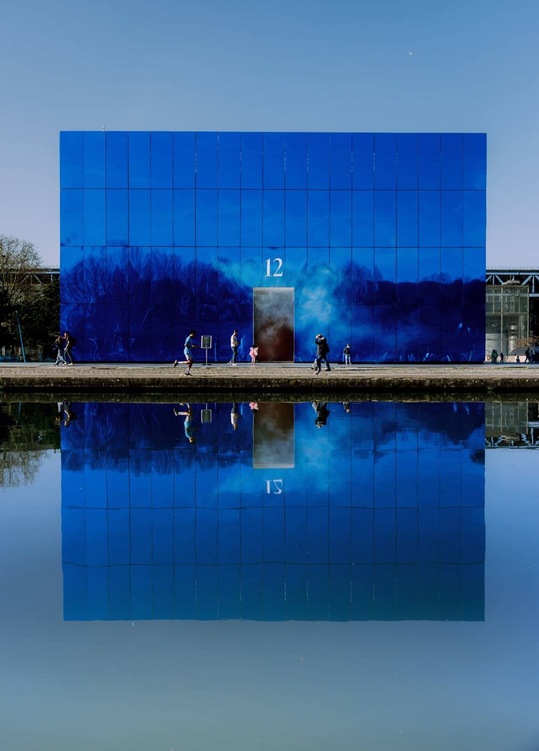 The blue cube of Prodigy12, reflected in the water